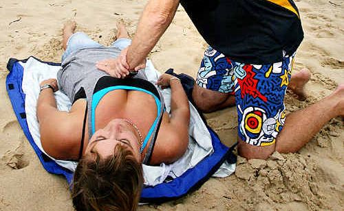 GOOD MOVE: Rob Campbell demonstrates cardiopulmonary resuscitation (CPR) on Kawana Surf Life Saving Club member Courtney Elsmore. GOOD MOVE: Rob Campbell demonstrates cardiopulmonary resuscitation (CPR) on Kawana Surf Life Saving Club member Courtney Elsmore.